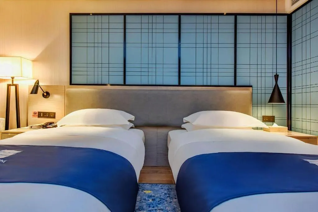 Bed in Echarm Hotel Anshun High-speed Railway Station Jichang Road