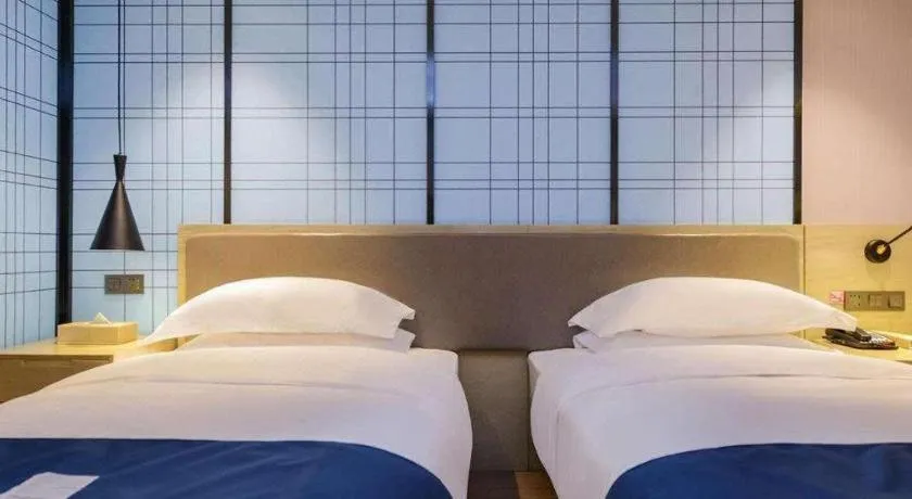 Bed in Echarm Hotel Anshun High-speed Railway Station Jichang Road
