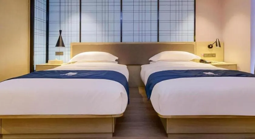 Bed in Echarm Hotel Anshun High-speed Railway Station Jichang Road