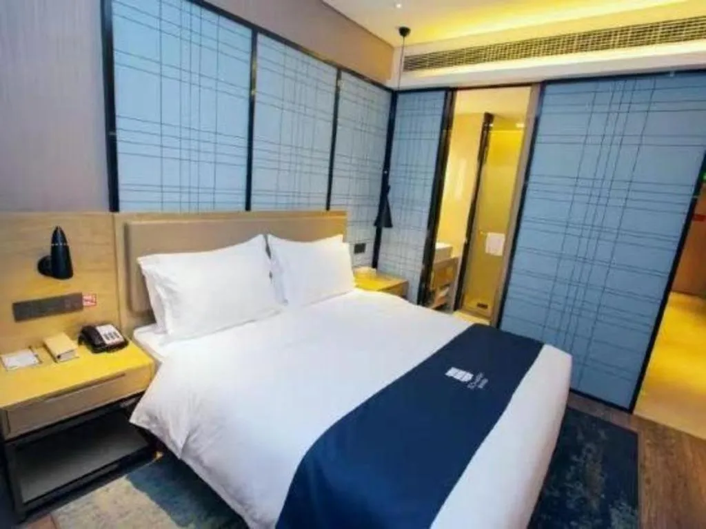 Bed in Echarm Hotel Nanning Guangxi University Xinyang Longteng District Maternal and Child Hospital