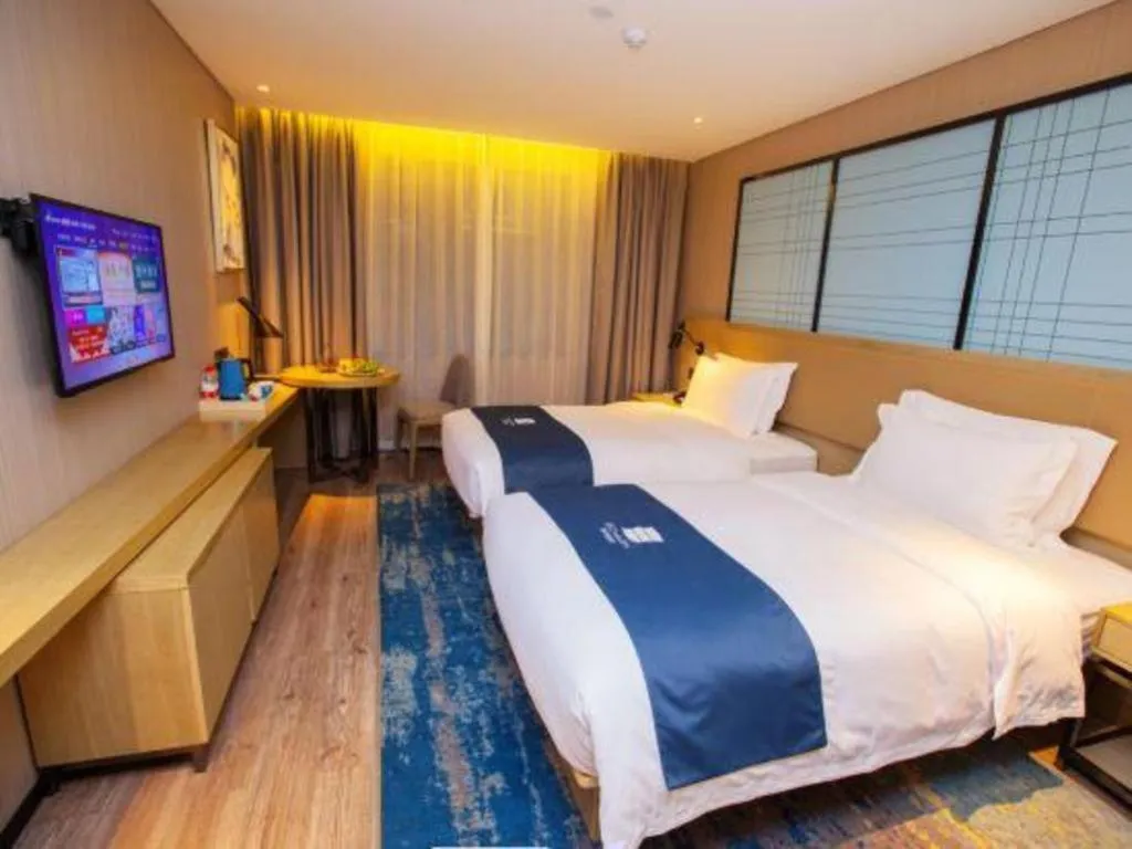 Bed in Echarm Hotel Nanning Guangxi University Xinyang Longteng District Maternal and Child Hospital