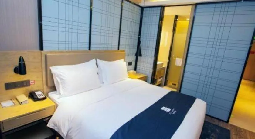 Bed in Echarm Hotel Nanning Guangxi University Xinyang Longteng District Maternal and Child Hospital