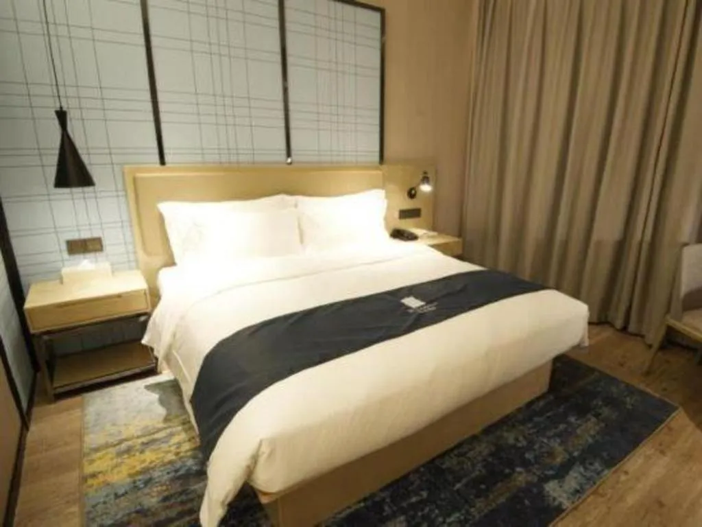 Bed in Echarm Hotel Nanning Guangxi University Xinyang Longteng District Maternal and Child Hospital