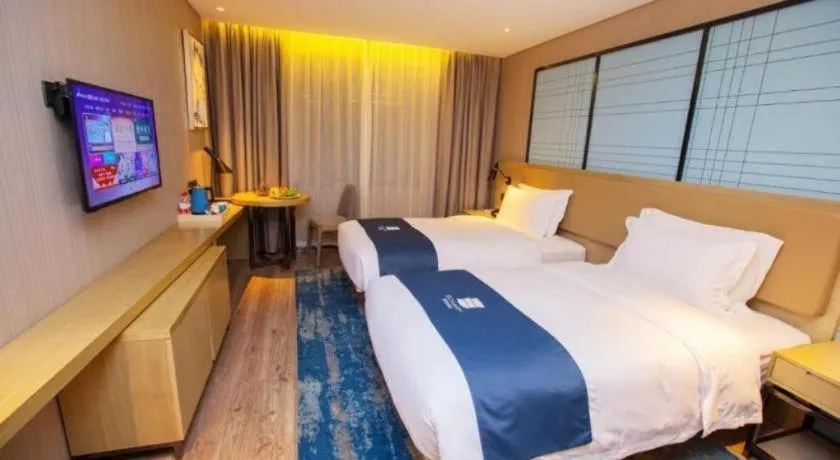 Bed in Echarm Hotel Nanning Guangxi University Xinyang Longteng District Maternal and Child Hospital