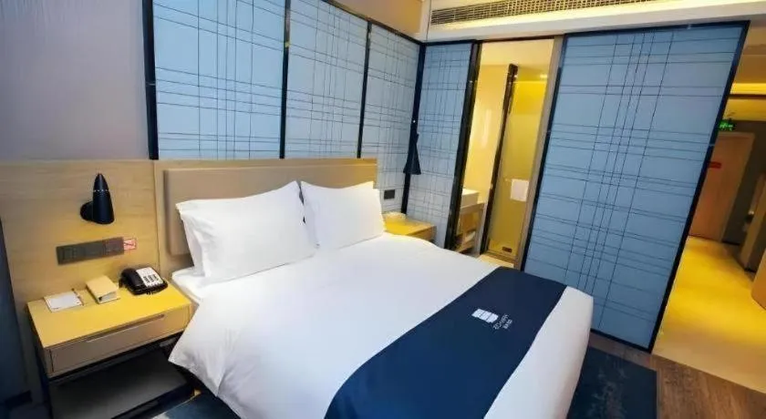 Bed in Echarm Hotel Nanning Guangxi University Xinyang Longteng District Maternal and Child Hospital