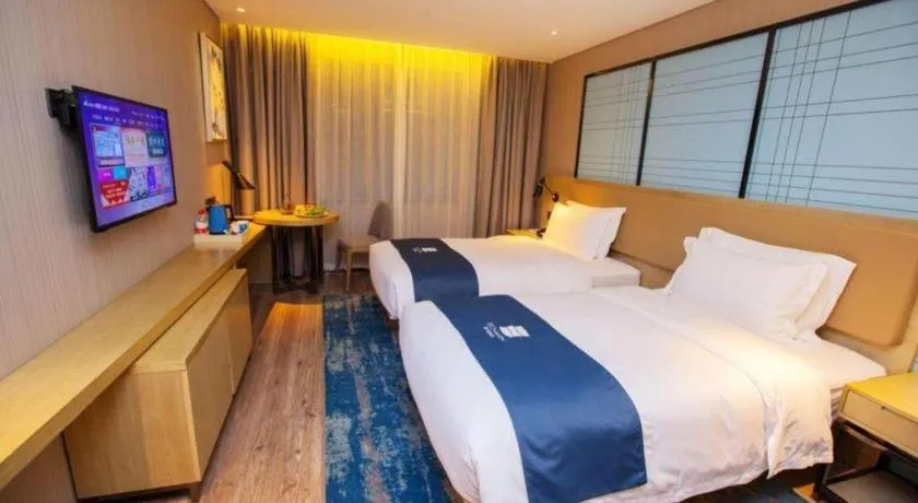 Bed in Echarm Hotel Nanning Guangxi University Xinyang Longteng District Maternal and Child Hospital