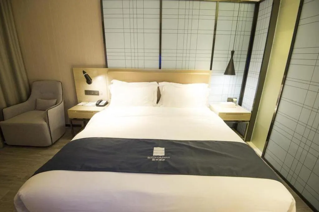 Bed in Echarm Hotel Nanning Guangxi University Xinyang Longteng District Maternal and Child Hospital