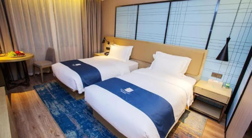 Bed in Echarm Hotel Nanning Guangxi University Xinyang Longteng District Maternal and Child Hospital