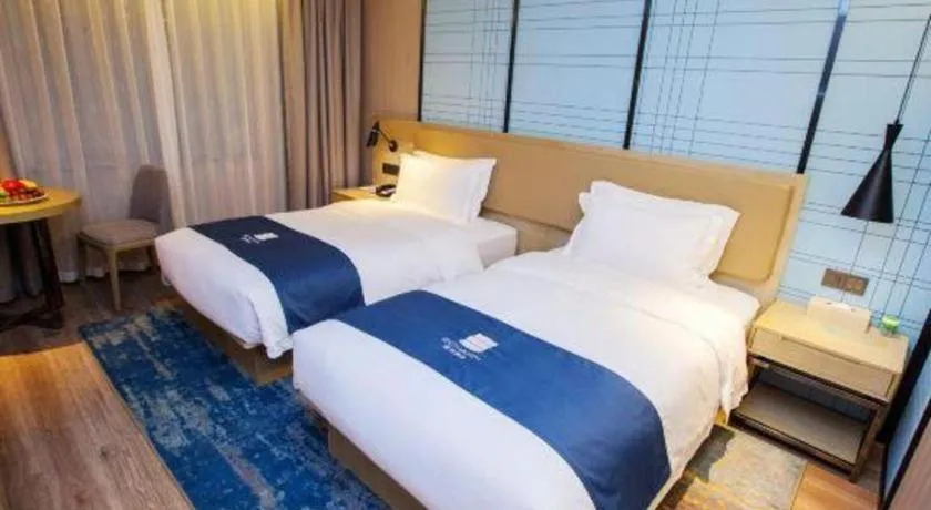 Bed in Echarm Hotel Nanning Guangxi University Xinyang Longteng District Maternal and Child Hospital