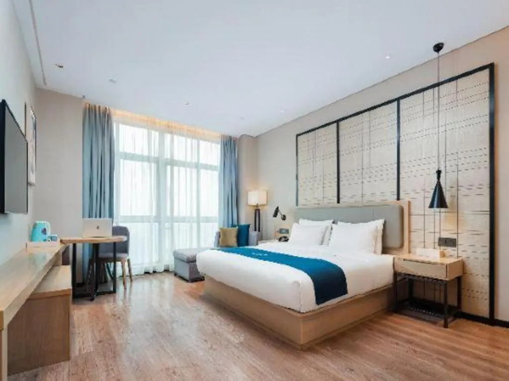Bed in Echarm Hotel Liuzhou Liunan Wanda Plaza