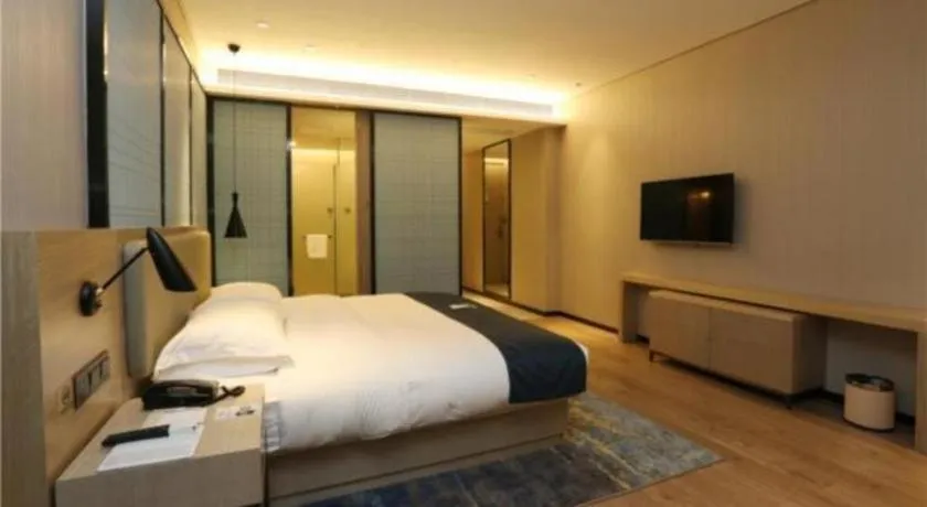 Bed in Echarm Hotel Liuzhou Liunan Wanda Plaza