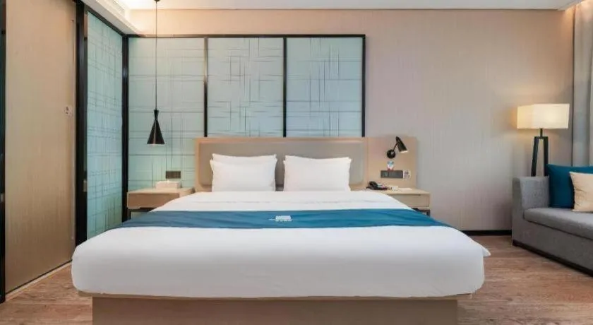 Bed in Echarm Hotel Liuzhou Liunan Wanda Plaza