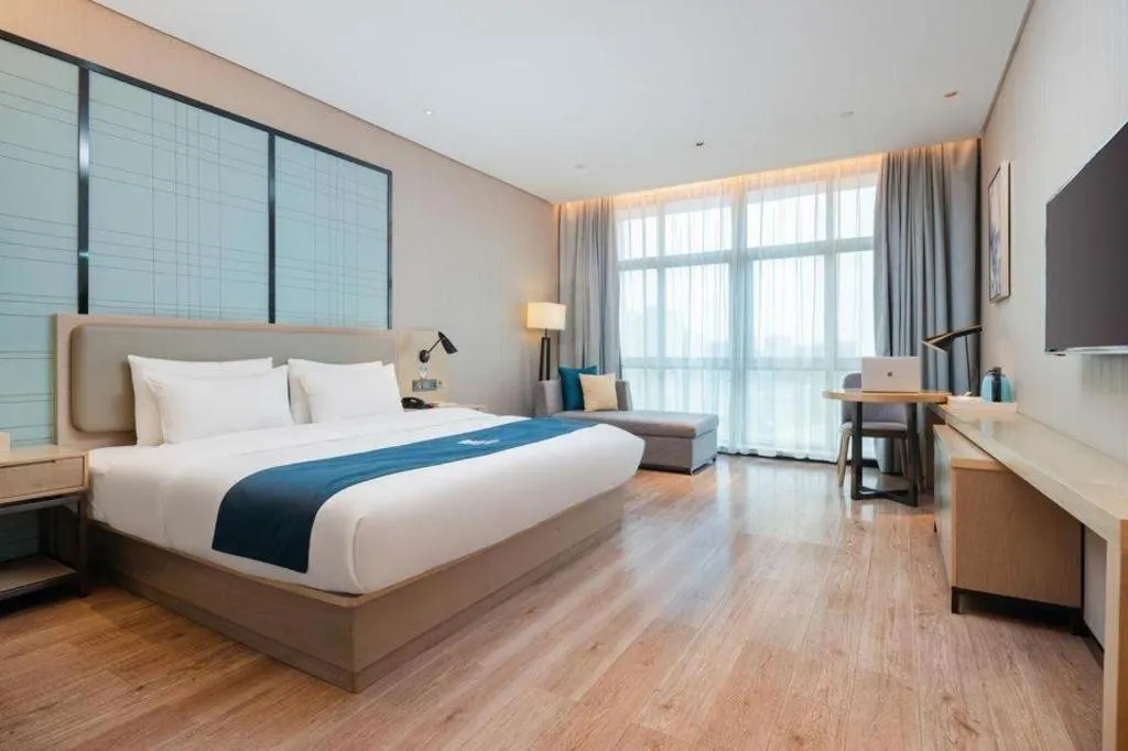 Bed in Echarm Hotel Liuzhou Liunan Wanda Plaza