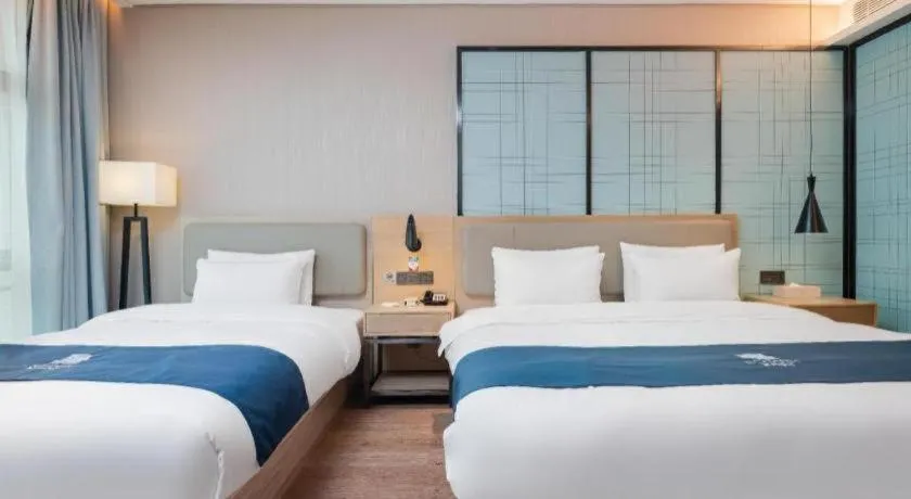 Bed in Echarm Hotel Liuzhou Liunan Wanda Plaza