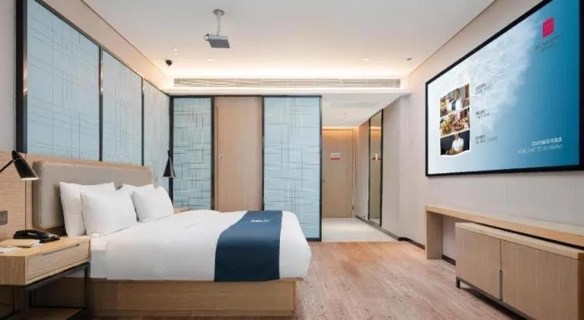 Bed in Echarm Hotel Liuzhou Liunan Wanda Plaza
