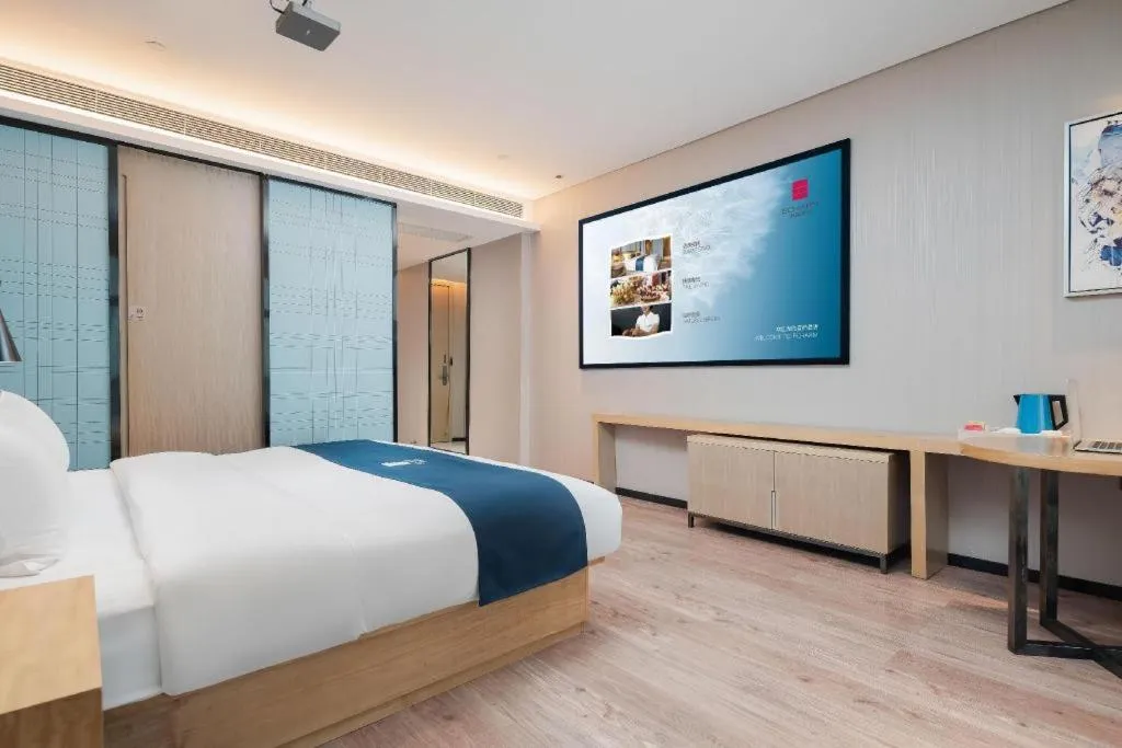 Bed in Echarm Hotel Liuzhou Liunan Wanda Plaza