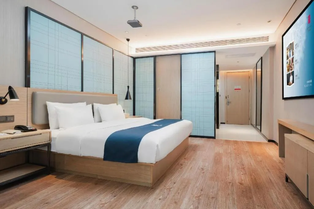 Bed in Echarm Hotel Liuzhou Liunan Wanda Plaza