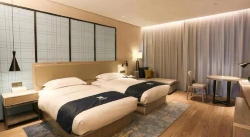 Bed in Echarm Hotel Liuzhou Liunan Wanda Plaza