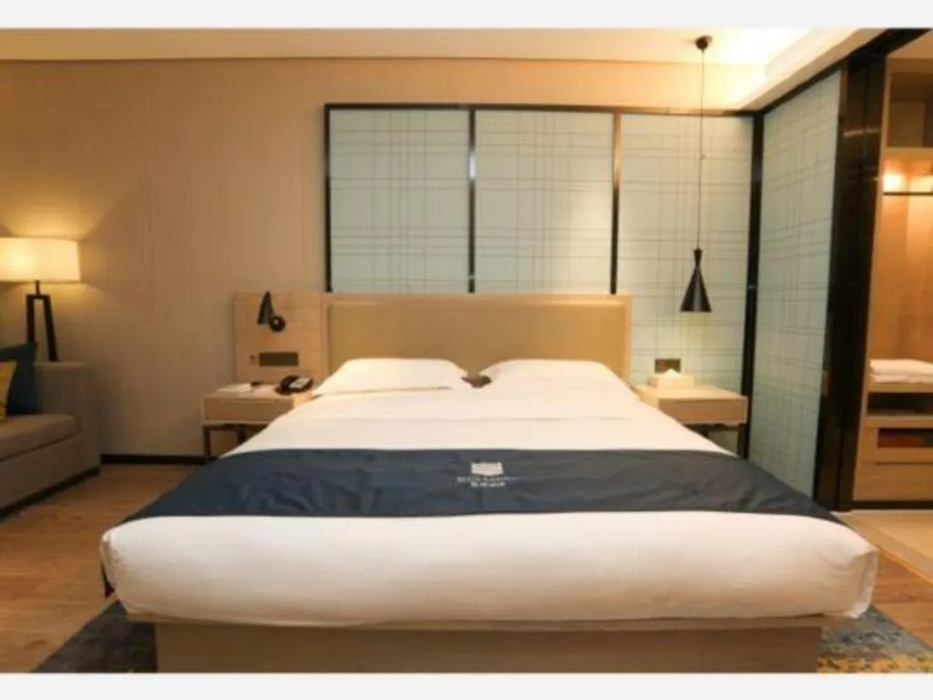 Bed in Echarm Hotel Liuzhou Liunan Wanda Plaza