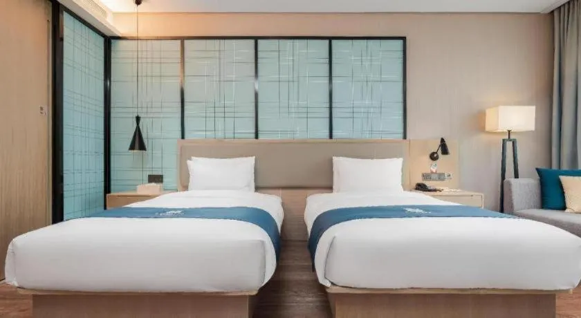 Bed in Echarm Hotel Liuzhou Liunan Wanda Plaza