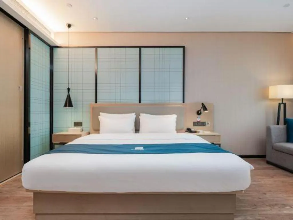 Bed in Echarm Hotel Liuzhou Liunan Wanda Plaza