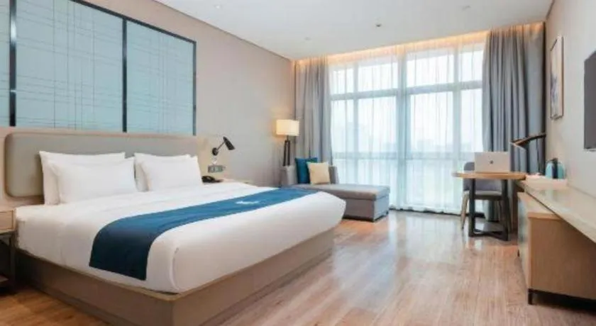 Bed in Echarm Hotel Liuzhou Liunan Wanda Plaza