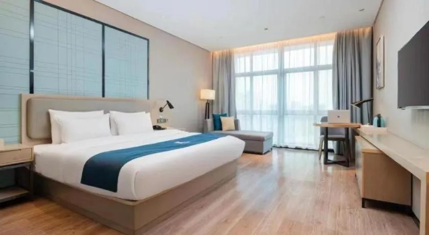 Bed in Echarm Hotel Liuzhou Liunan Wanda Plaza