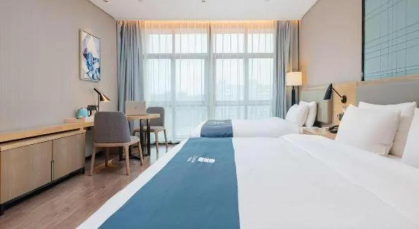 Bed in Echarm Hotel Liuzhou Liunan Wanda Plaza
