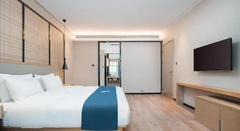 Bed in Echarm Hotel Liuzhou Liunan Wanda Plaza