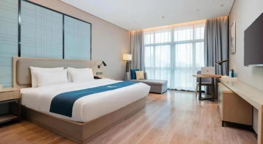 Bed in Echarm Hotel Liuzhou Liunan Wanda Plaza