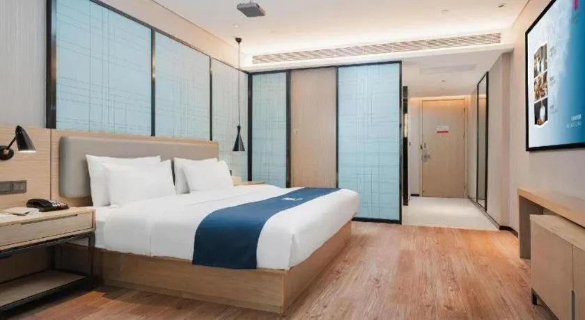 Bed in Echarm Hotel Liuzhou Liunan Wanda Plaza
