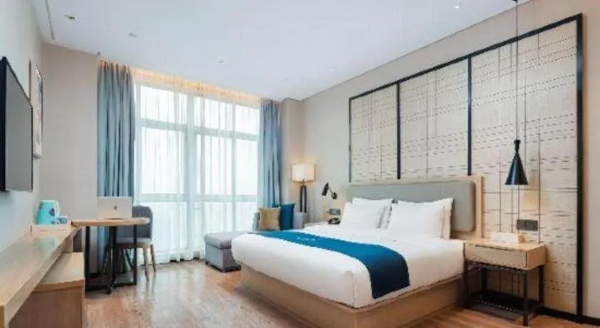 Bed in Echarm Hotel Liuzhou Liunan Wanda Plaza