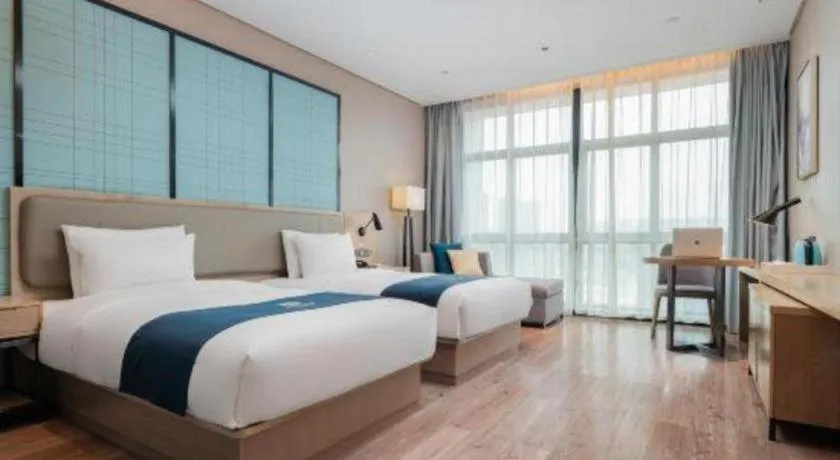 Bed in Echarm Hotel Liuzhou Liunan Wanda Plaza