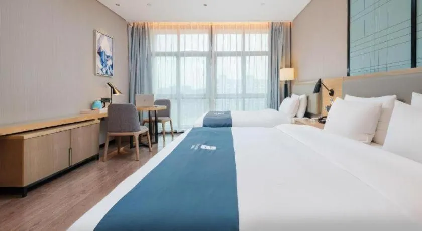 Bed in Echarm Hotel Liuzhou Liunan Wanda Plaza