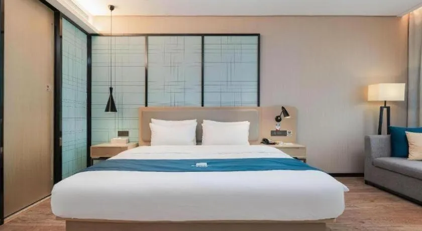 Bed in Echarm Hotel Liuzhou Liunan Wanda Plaza