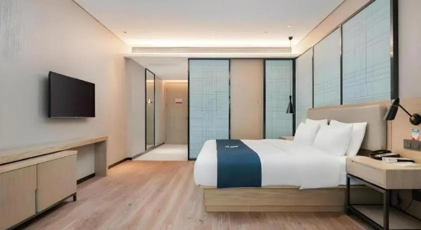 Bed in Echarm Hotel Liuzhou Liunan Wanda Plaza