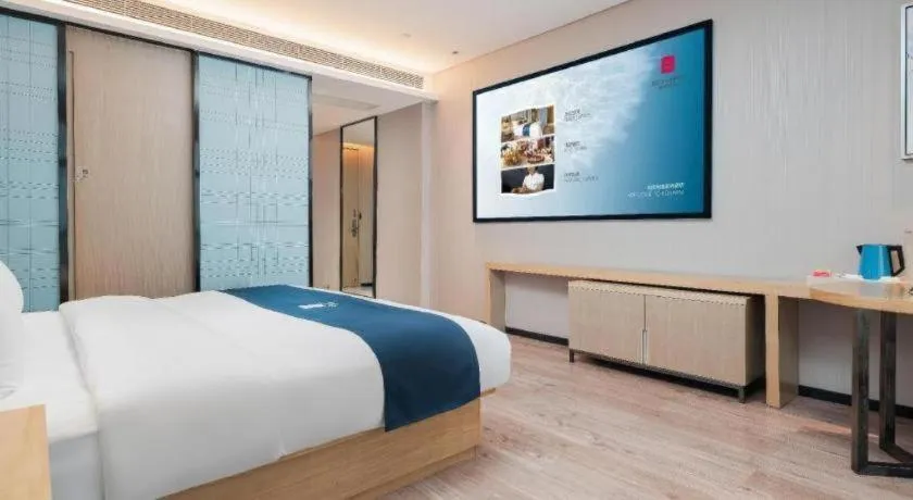 Bed in Echarm Hotel Liuzhou Liunan Wanda Plaza
