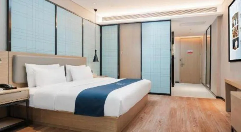 Bed in Echarm Hotel Liuzhou Liunan Wanda Plaza