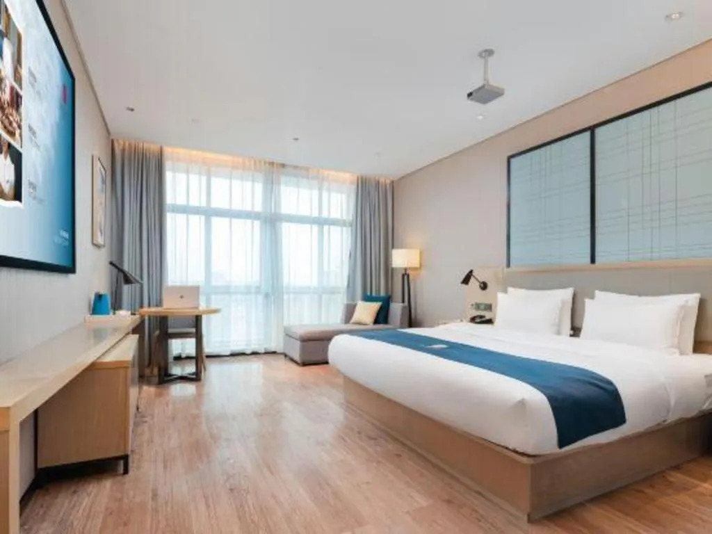 Bed in Echarm Hotel Liuzhou Liunan Wanda Plaza