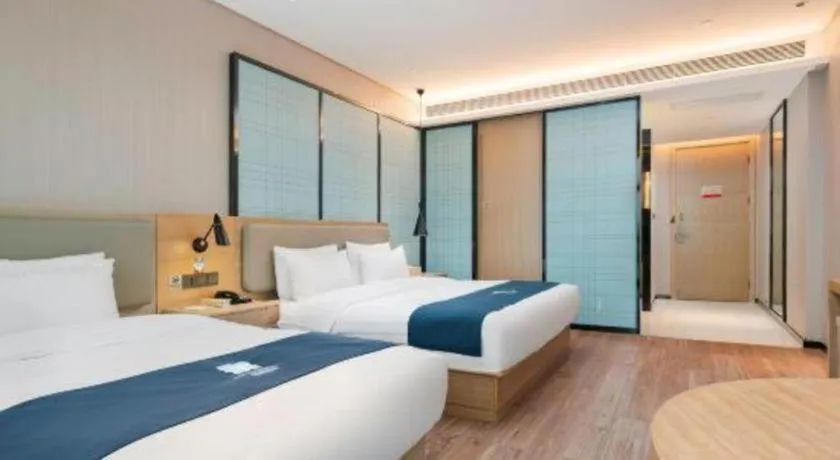 Bed in Echarm Hotel Liuzhou Liunan Wanda Plaza