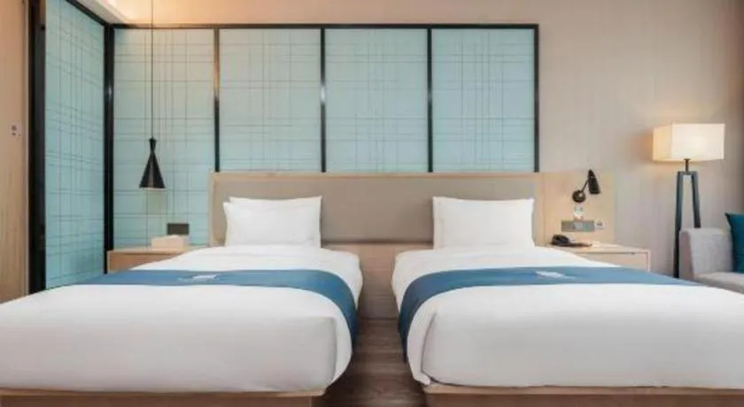 Bed in Echarm Hotel Liuzhou Liunan Wanda Plaza