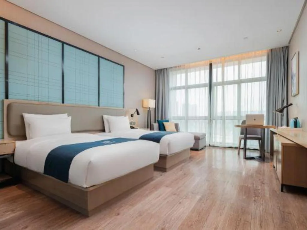 Bed in Echarm Hotel Liuzhou Liunan Wanda Plaza