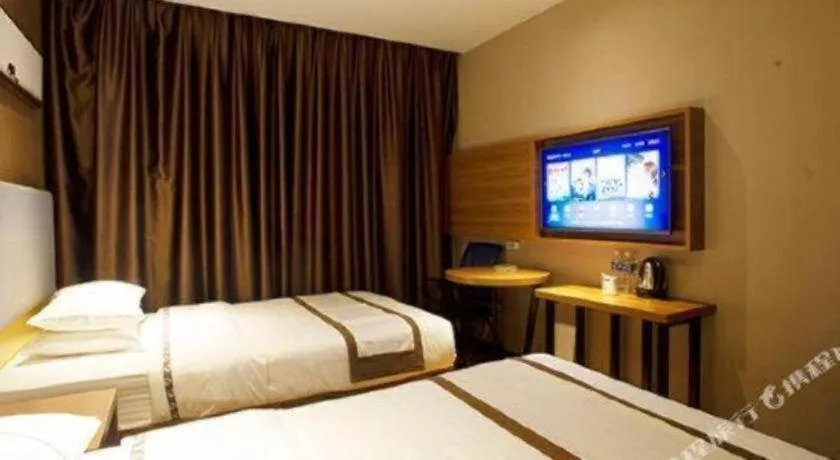 Bed in Jtour Inn Huanggang Wuxue City Square