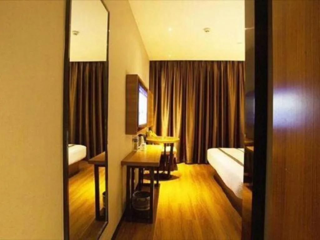 Bed in Jtour Inn Huanggang Wuxue City Square