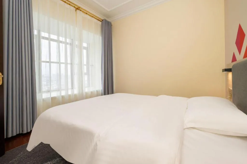 Bed in Borrman Hotel Guilin High-speed Railway North Station Evergrande Plaza