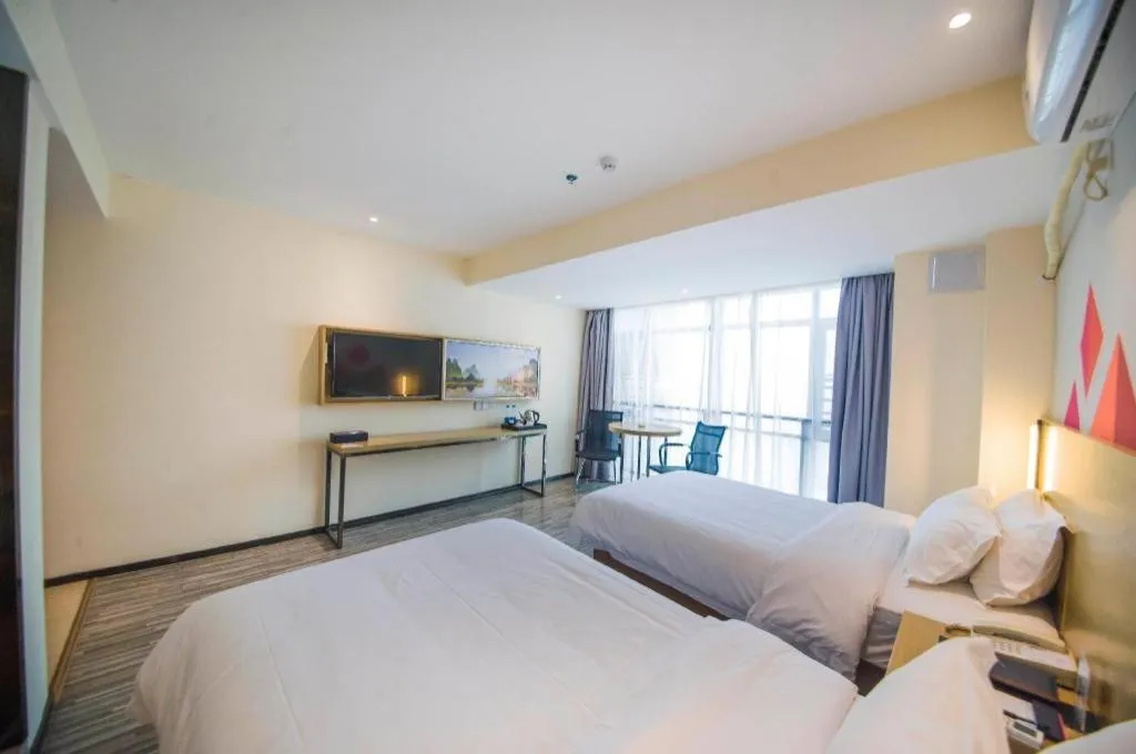 Bed in Borrman Hotel Guilin High-speed Railway North Station Evergrande Plaza