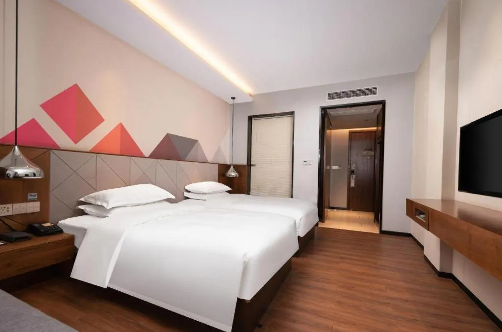 Bed in Borrman Hotel Qianjiang High-speed Railway Station Lobster City