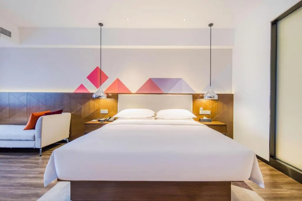 Bed in Borrman Hotel Qianjiang High-speed Railway Station Lobster City