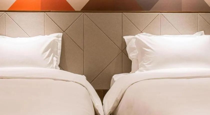 Bed in Borrman Hotel Qianjiang High-speed Railway Station Lobster City