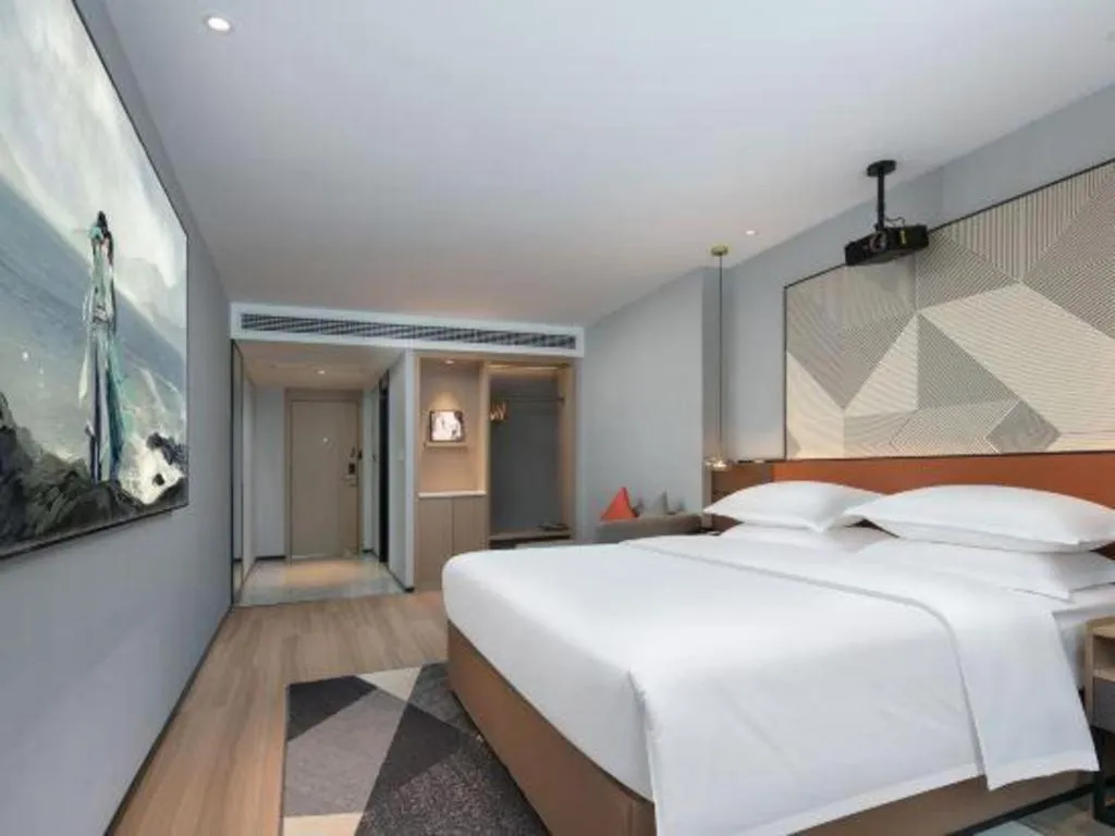 Bed in Borrman Hotel Qianjiang High-speed Railway Station Lobster City